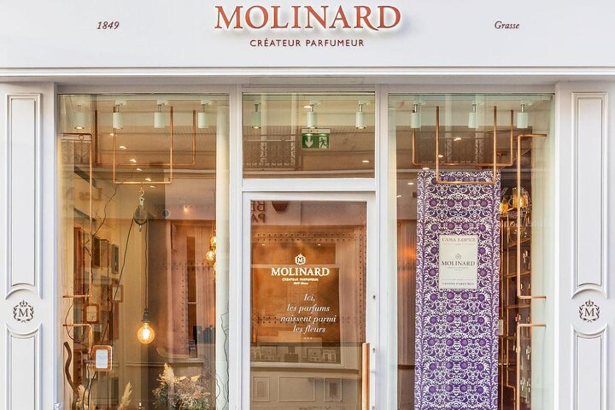 a store front with a purple sign in the window