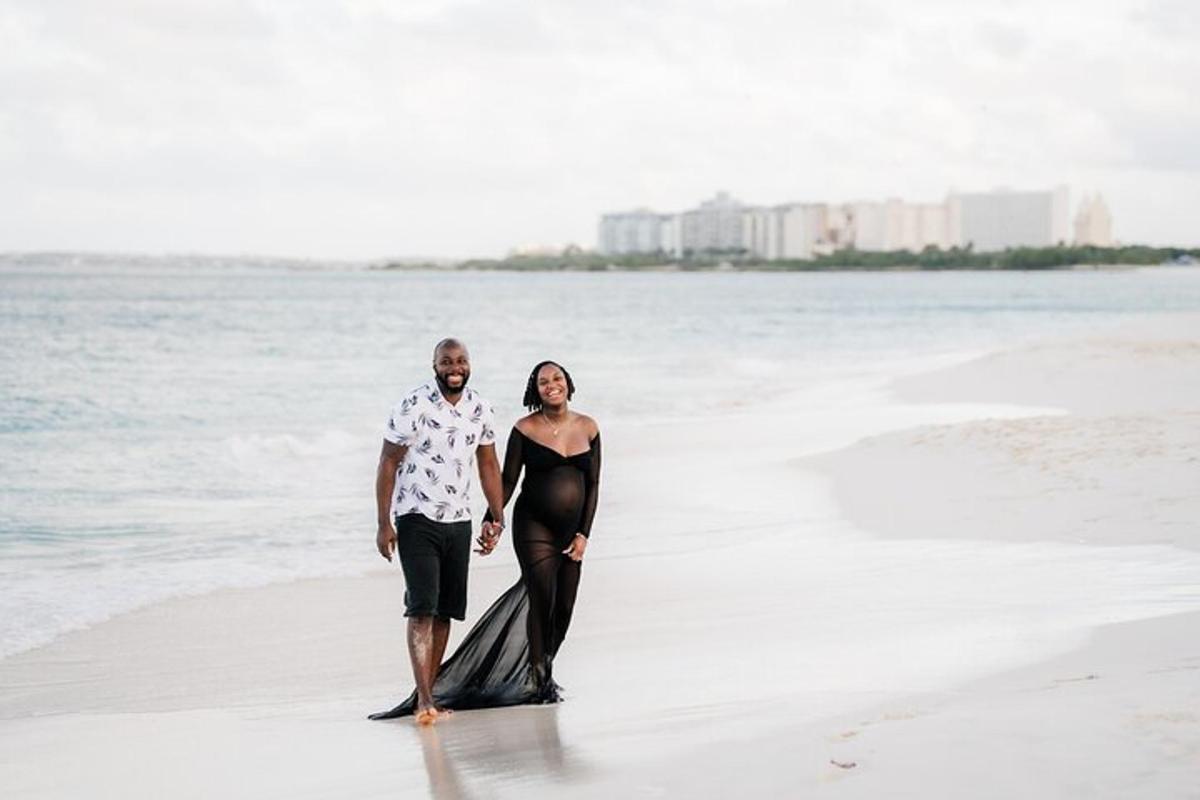 a man and a woman standing on the beach