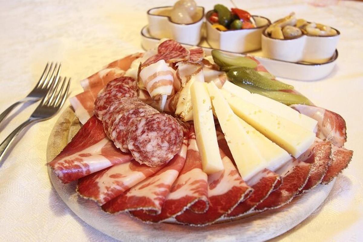 a plate of cheese and other foods on a table