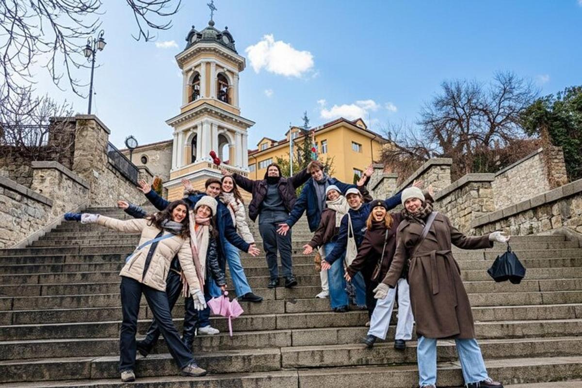 a group of people standing on steps in front of a building