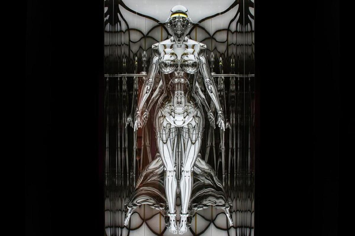 a clear glass vase with a skeleton in it