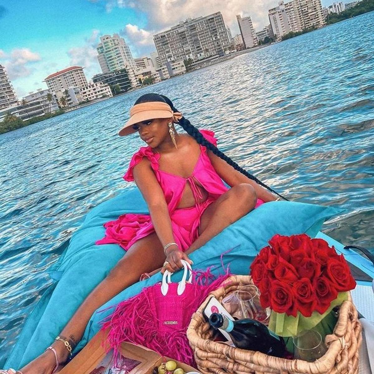 a woman sitting in a boat on the water