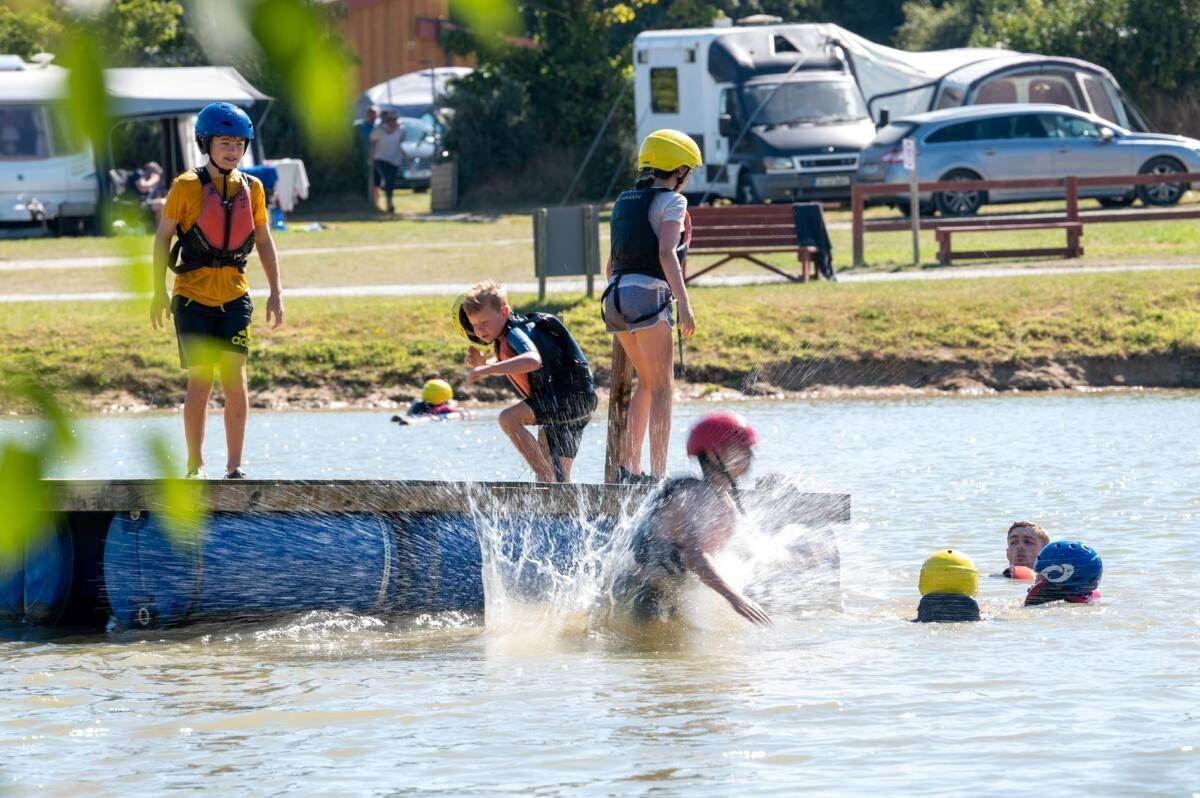 a group of people playing in the water