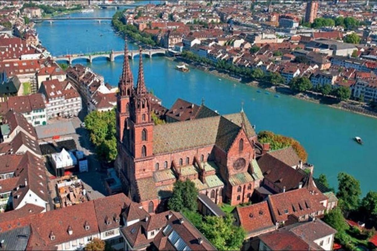 an aerial view of a building next to a river