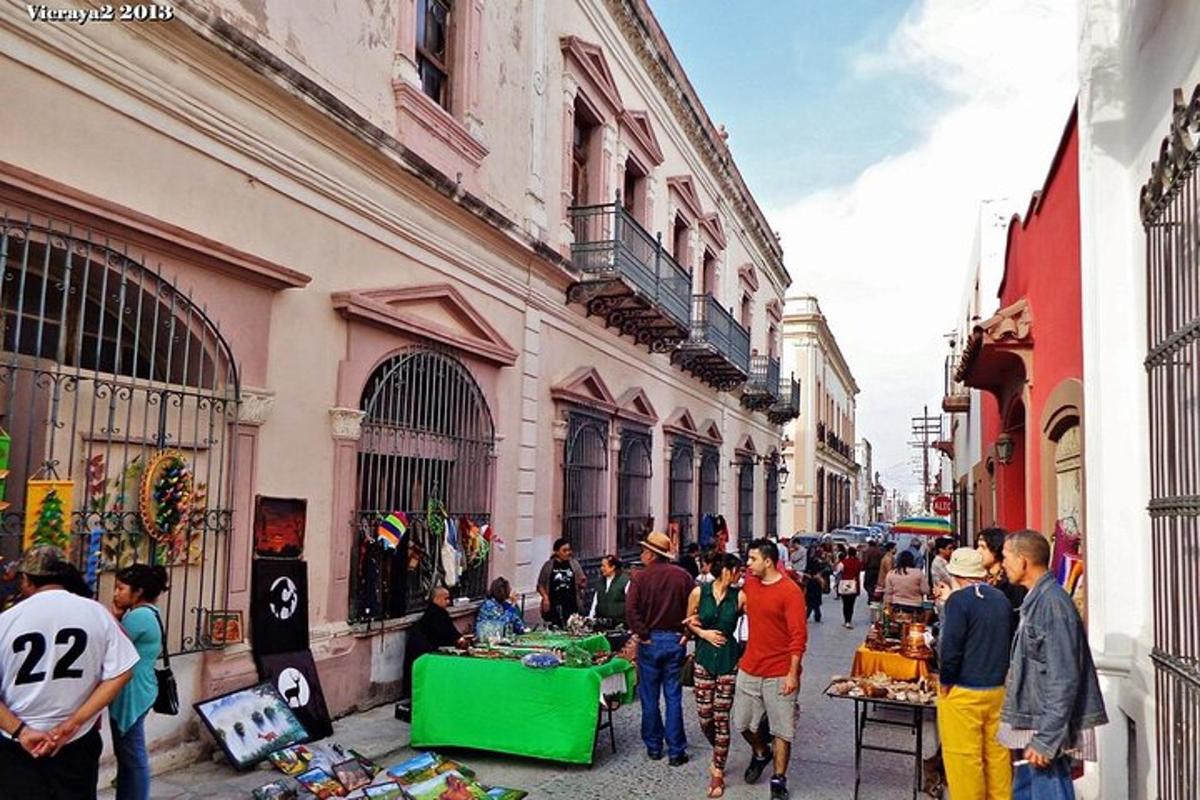 a group of people walking around a street market