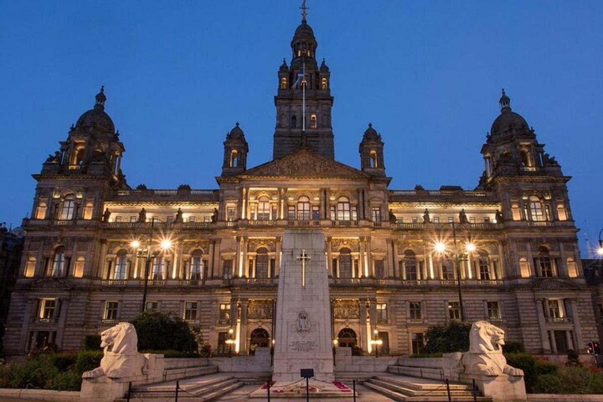 a large building with a monument in front of it