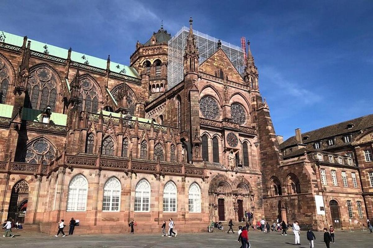 a large building with people walking in front of it