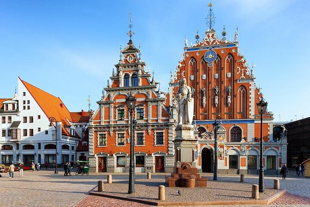 a large building with a clock tower in a city