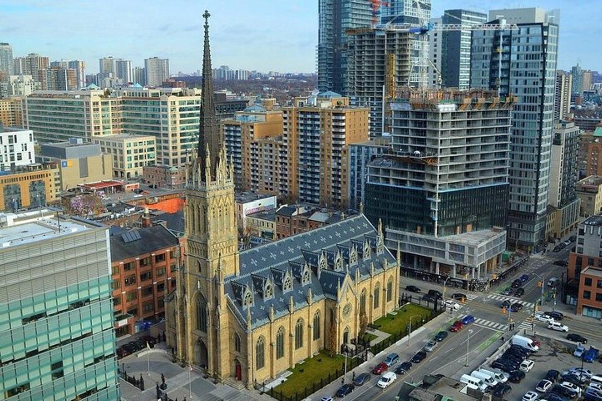 a large building with a clock tower in a city