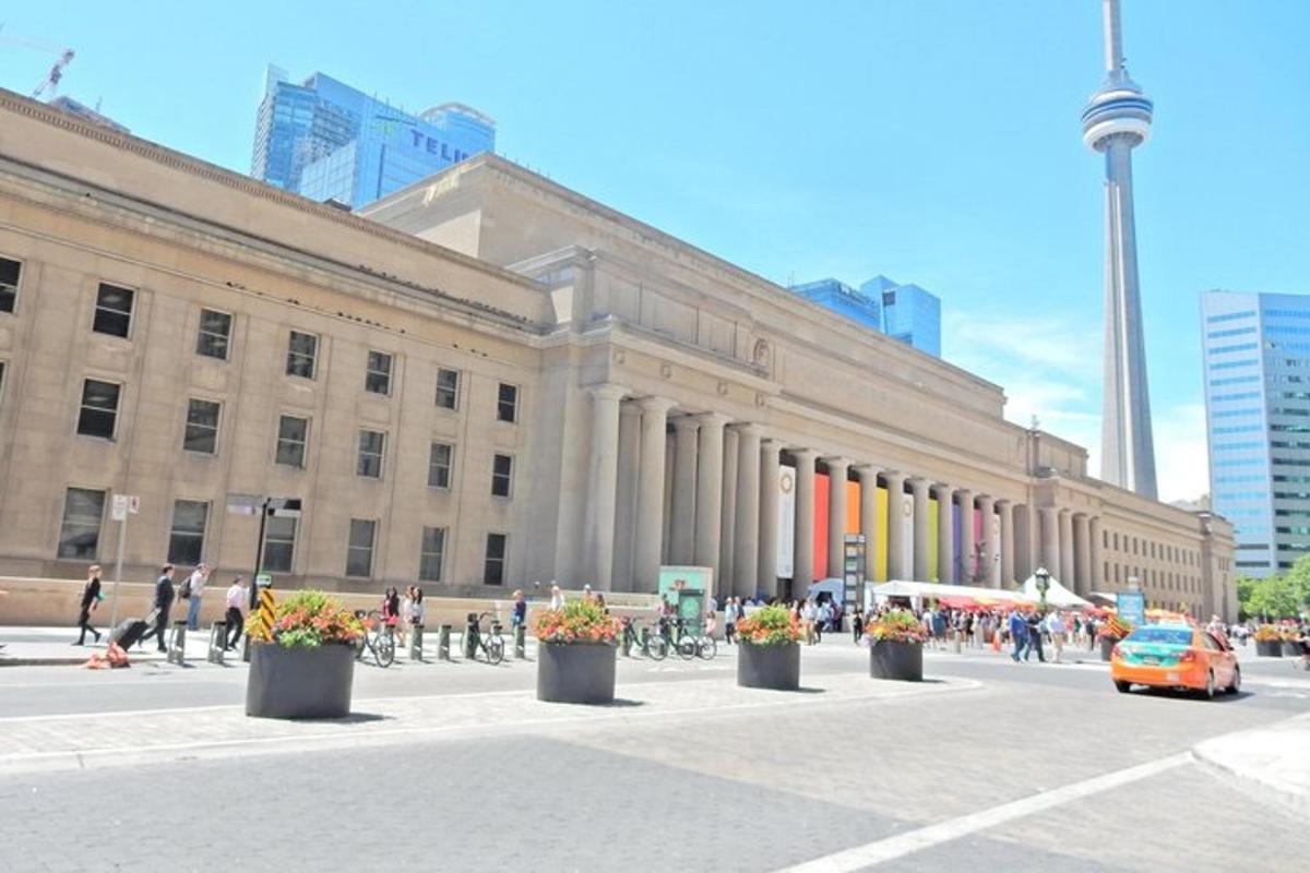 a large building with people on bikes in front of it
