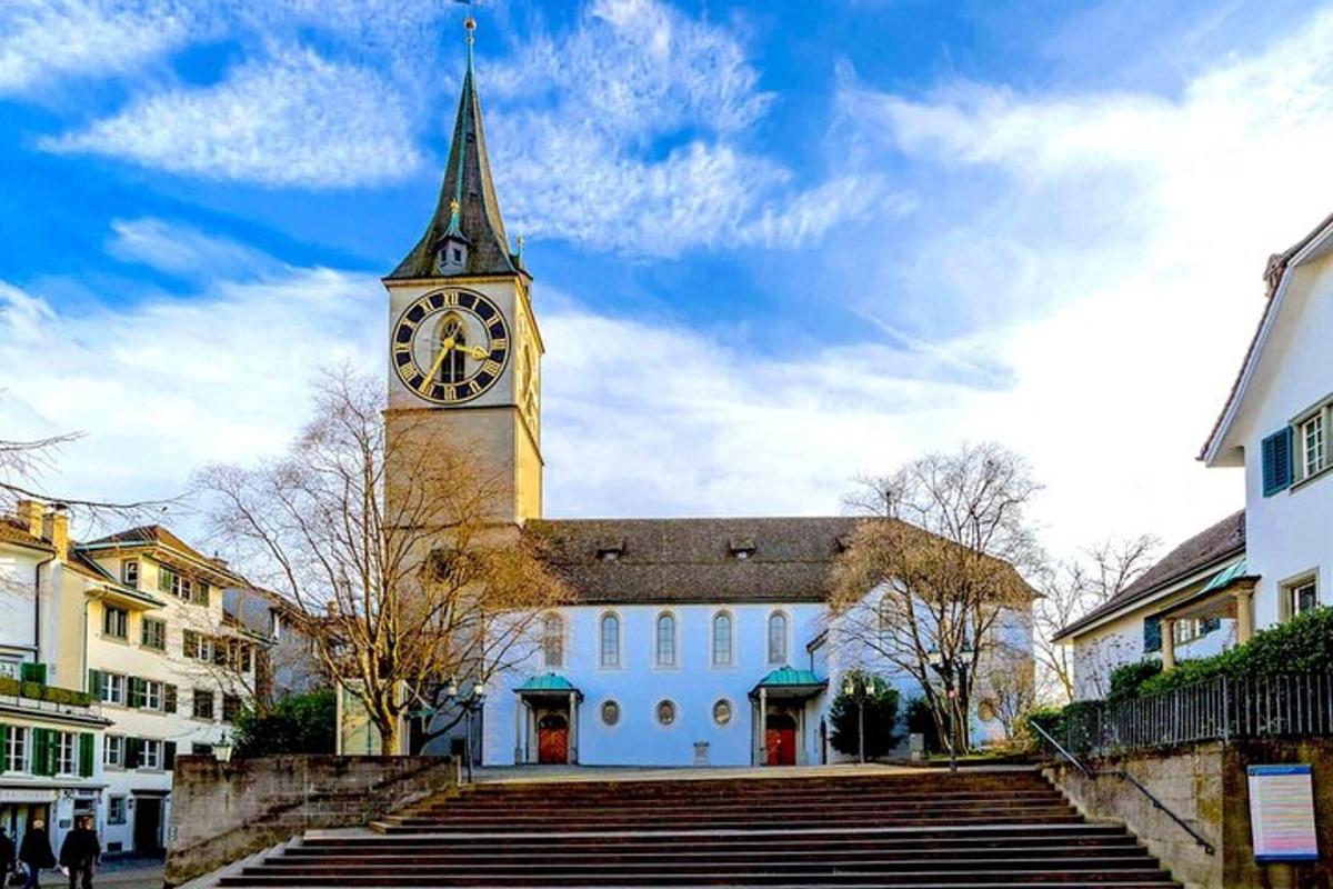 a clock tower on top of a building with stairs
