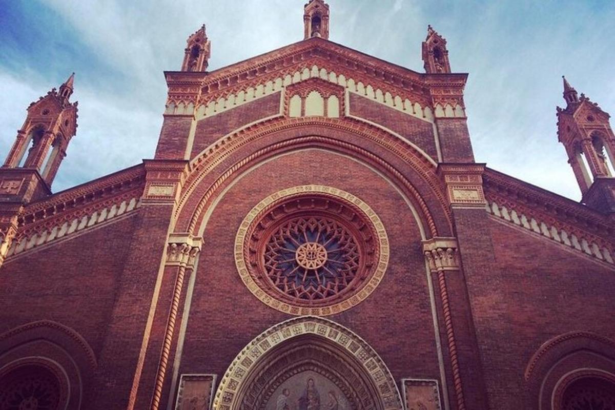 a large brick building with an archway on it