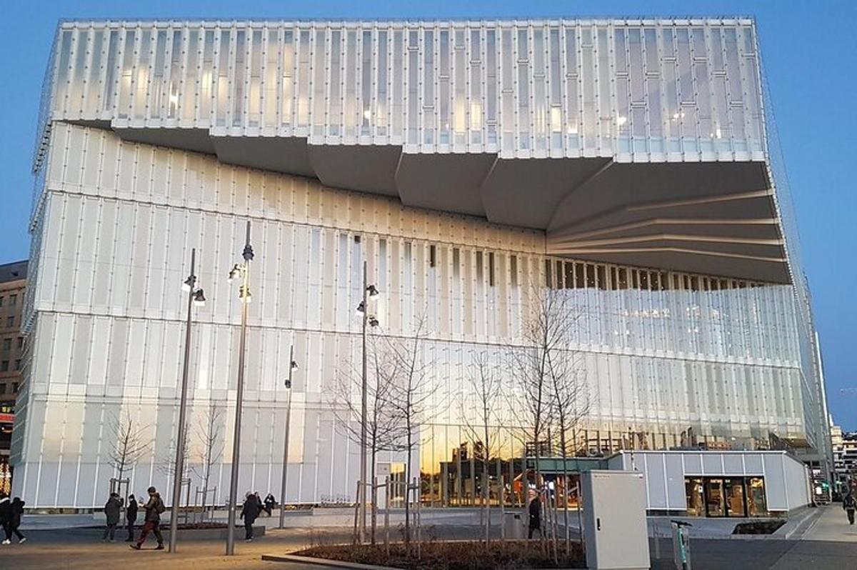 a large building with people standing outside of it