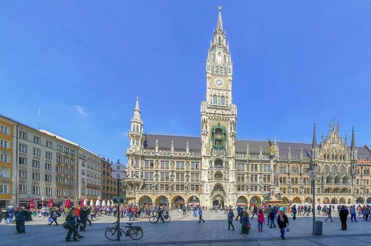 a large building with a clock tower in front of it