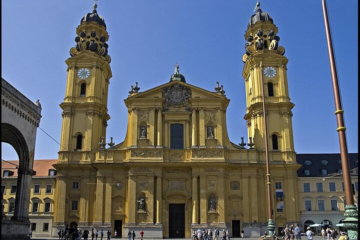a large building with two towers with clocks on it