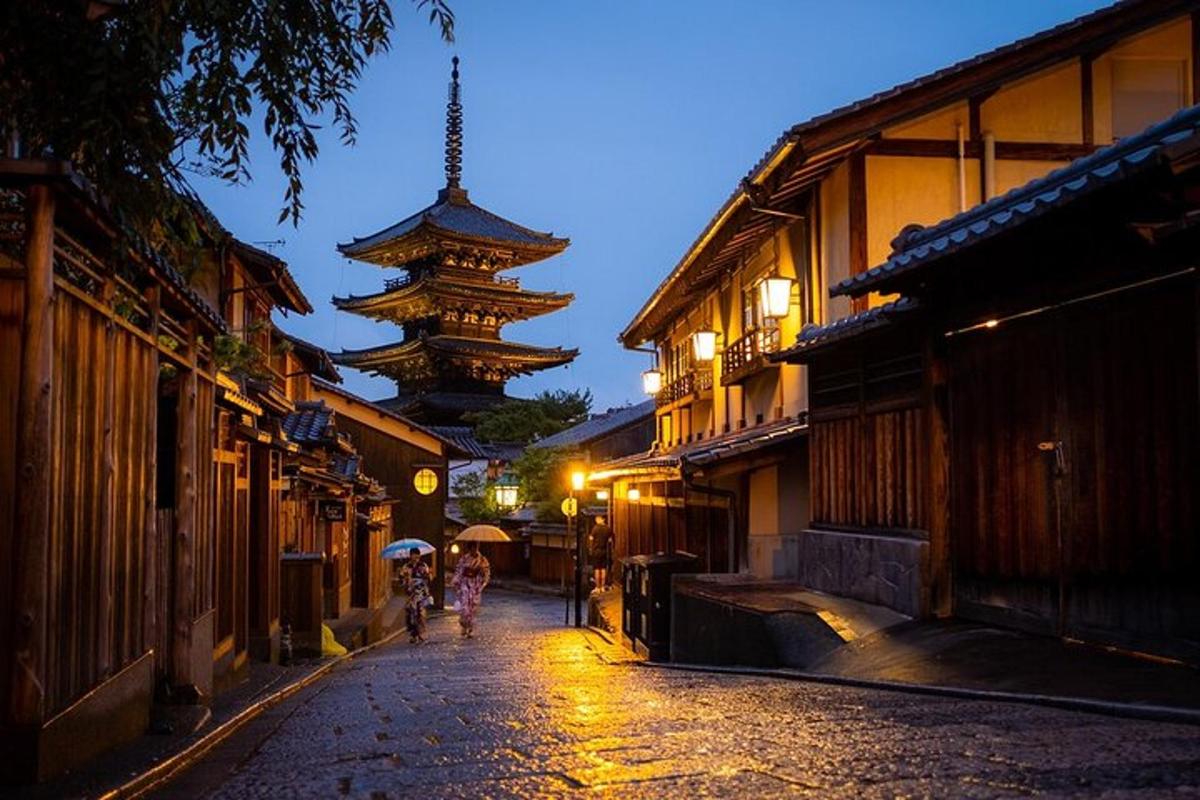 a street with people walking down a street with buildings