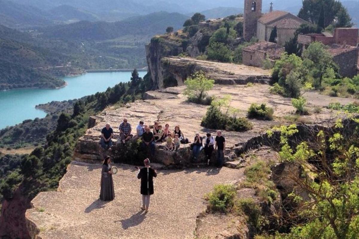 a group of people standing on top of a mountain