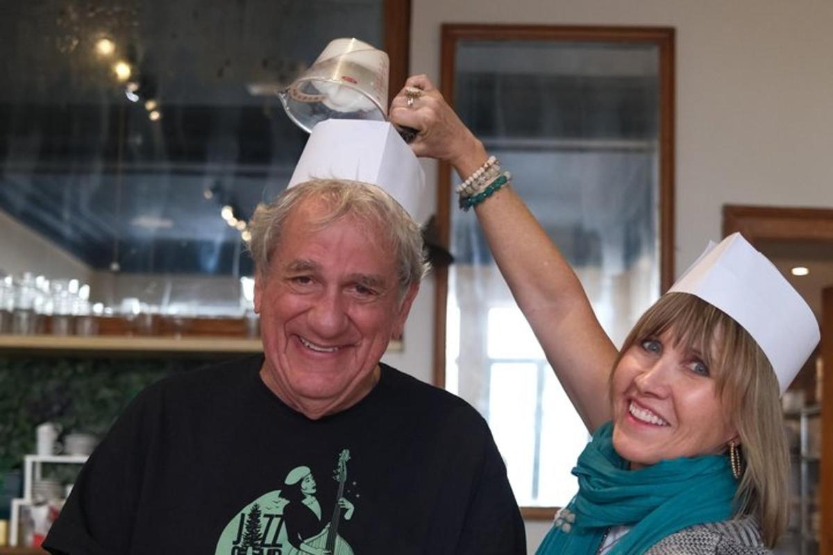 a man and a woman holding a wine glass