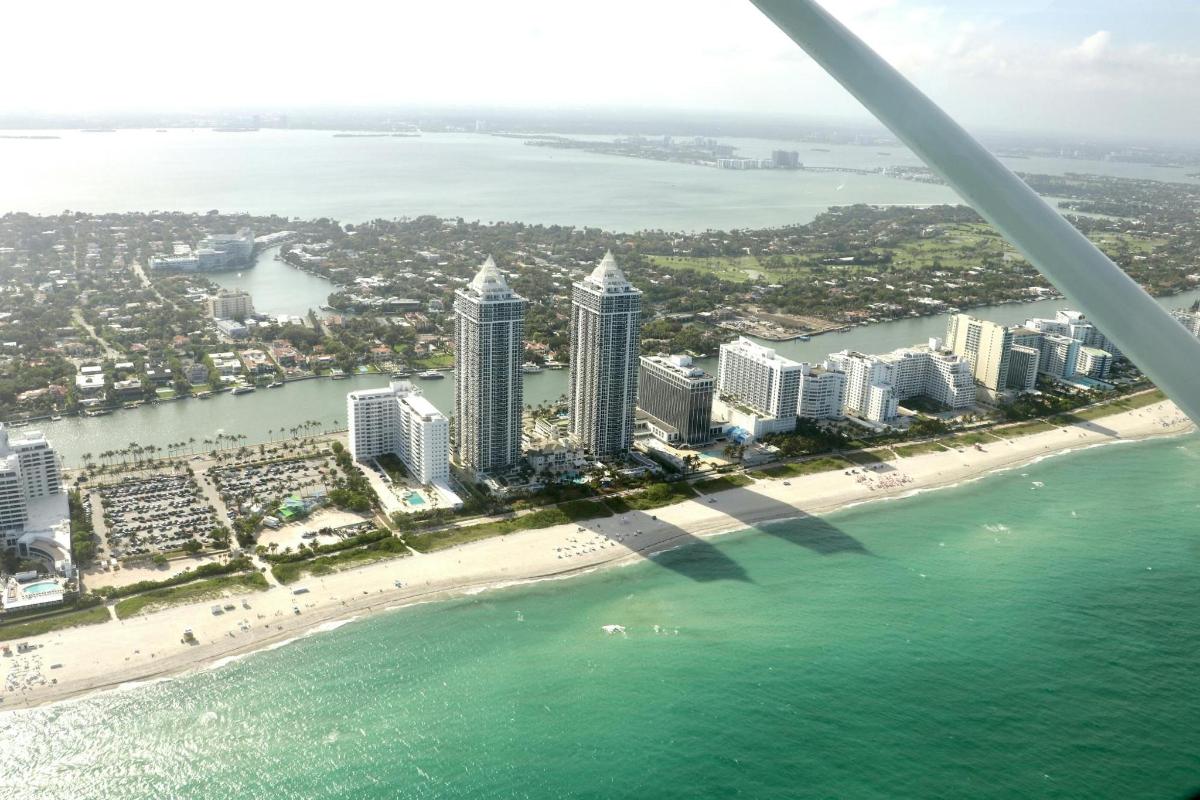an aerial view of a beach and buildings