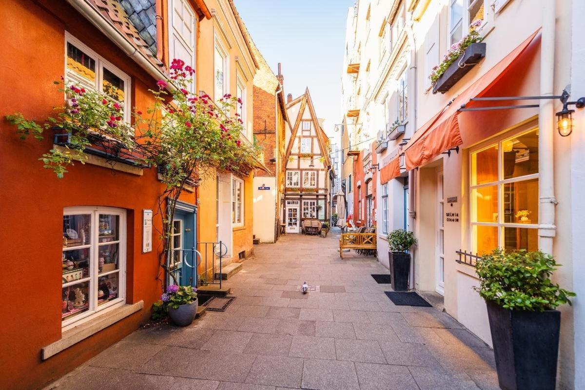 an alley in an old town with buildings