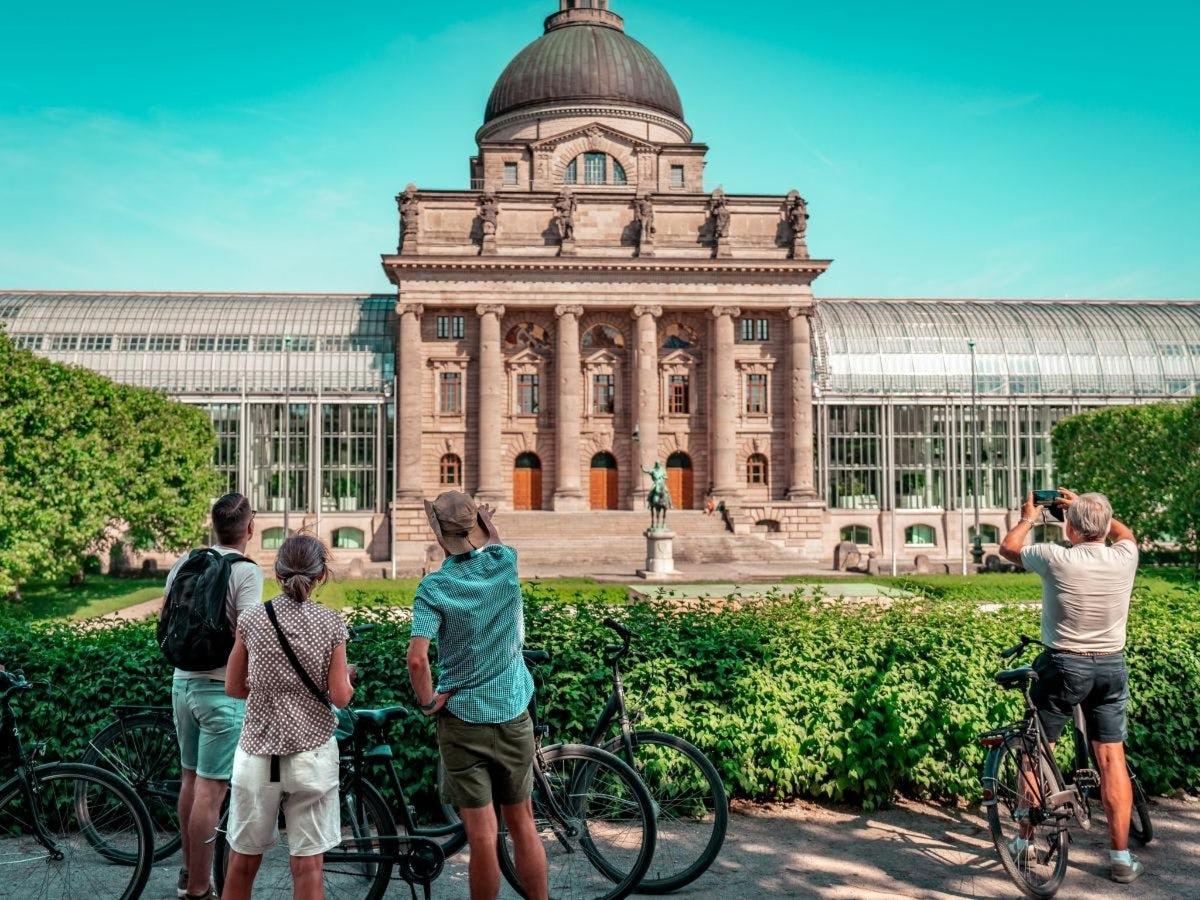 a group of people standing in front of a building