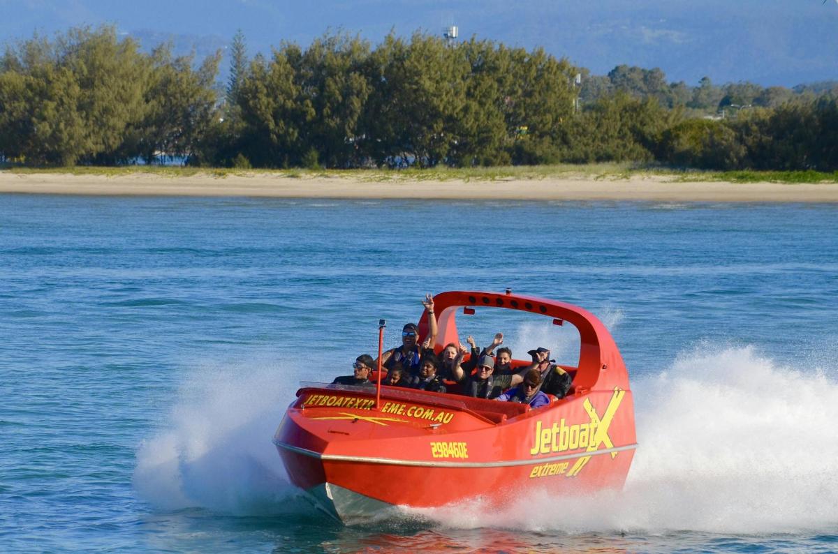 a group of people on a boat in the water