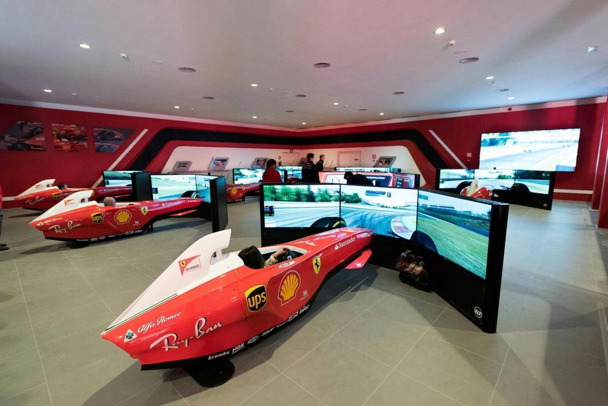 a room with two toy cars and a tv