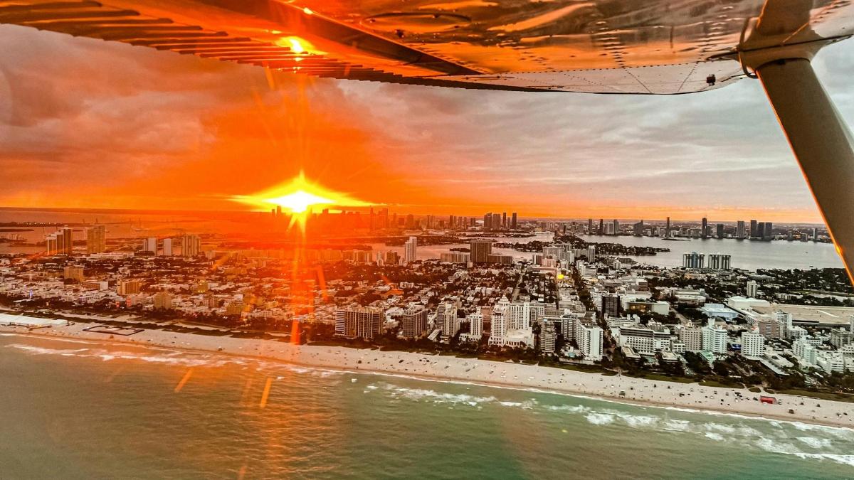 a view of a city at sunset from an airplane
