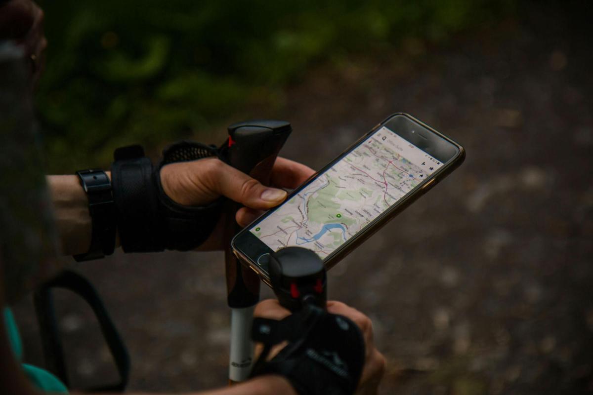 a person holding a cell phone with a camera