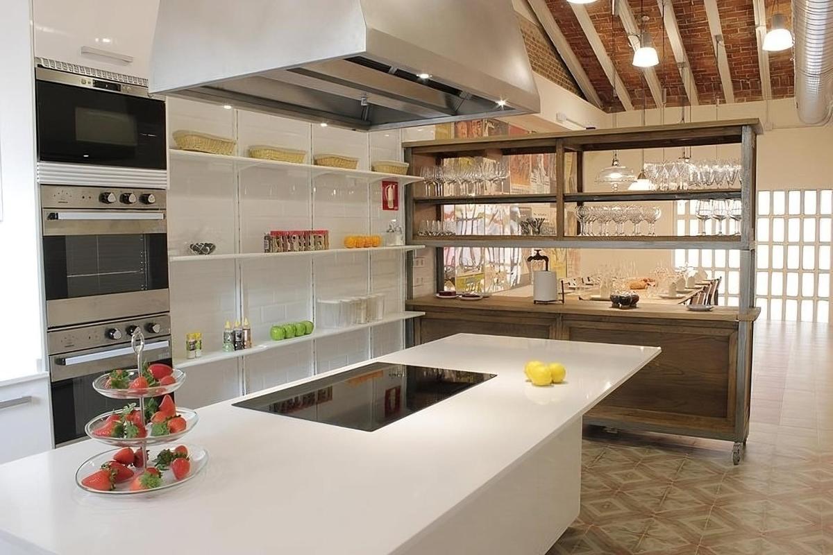 a kitchen with a white counter top in a room