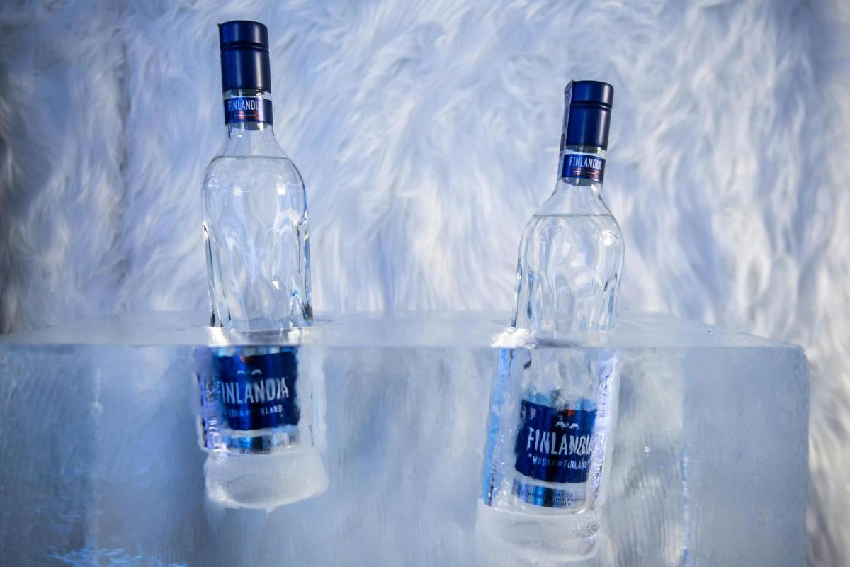 two bottles of water sitting on top of a table