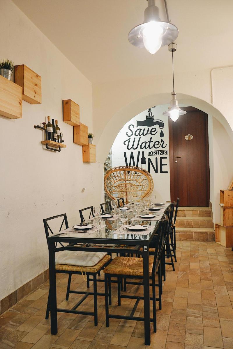 a dining room with a black table and chairs