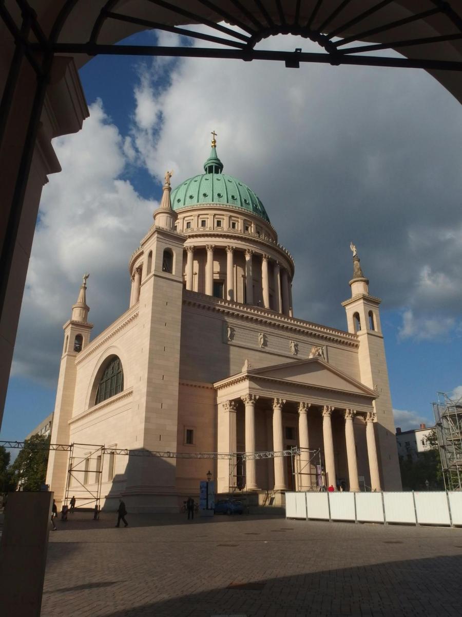 a building with a green dome on top of it