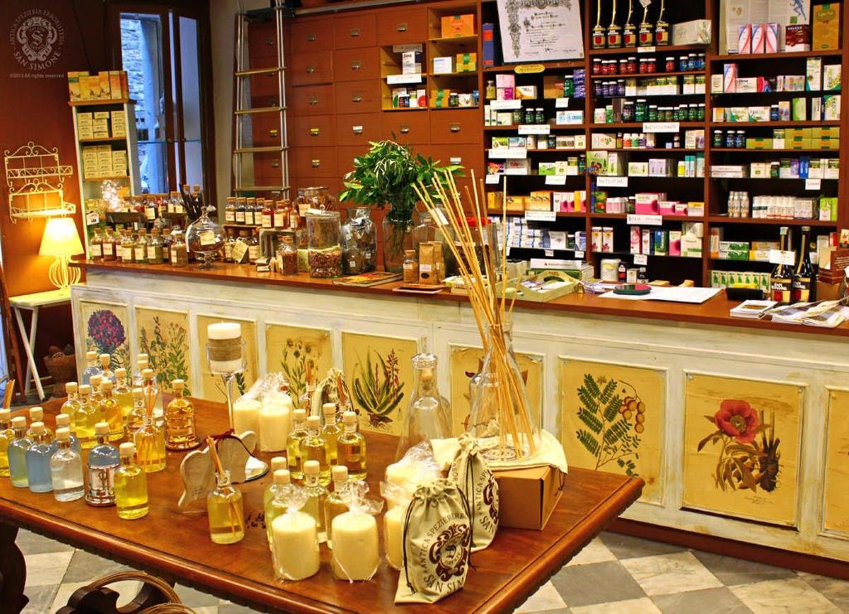 a store with a counter with bottles and candles