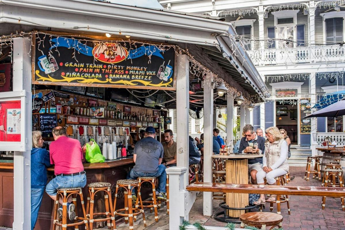 a group of people sitting at a bar