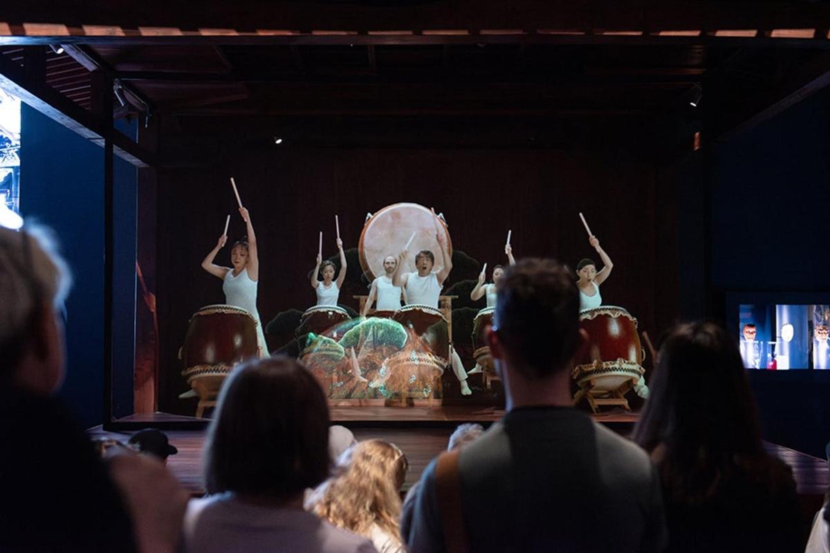 a crowd of people watching a performance in a theatre