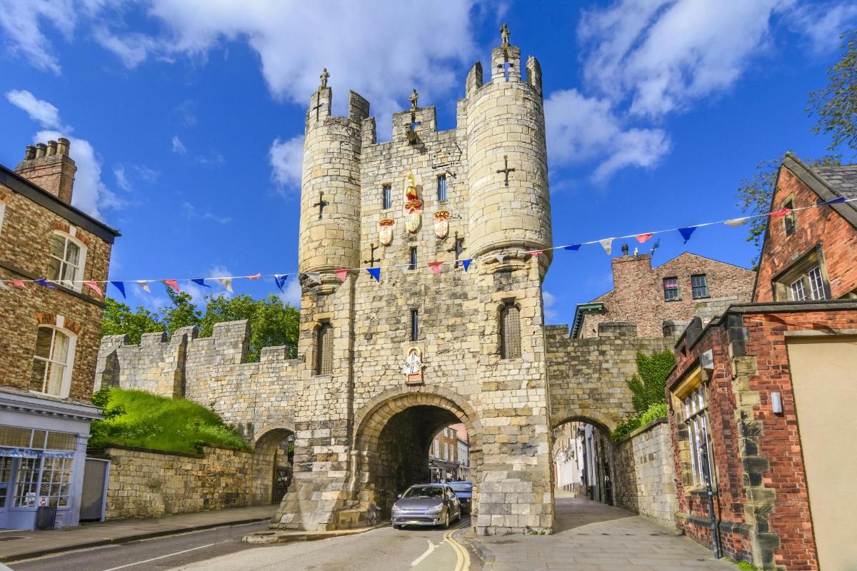a castle with a car parked in front of it