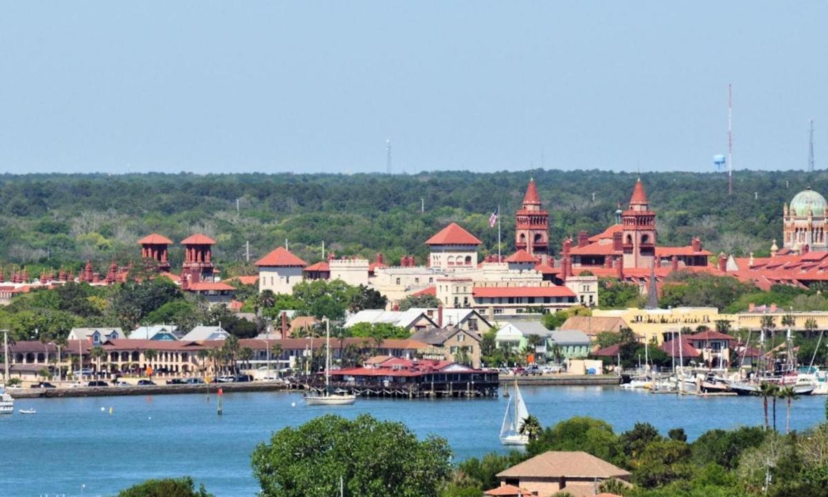 a view of a town with boats on the water