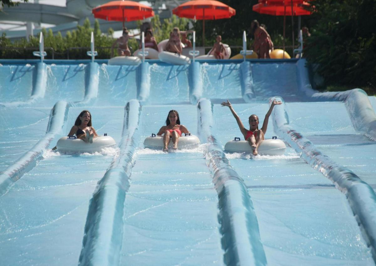 a group of children in a swimming pool