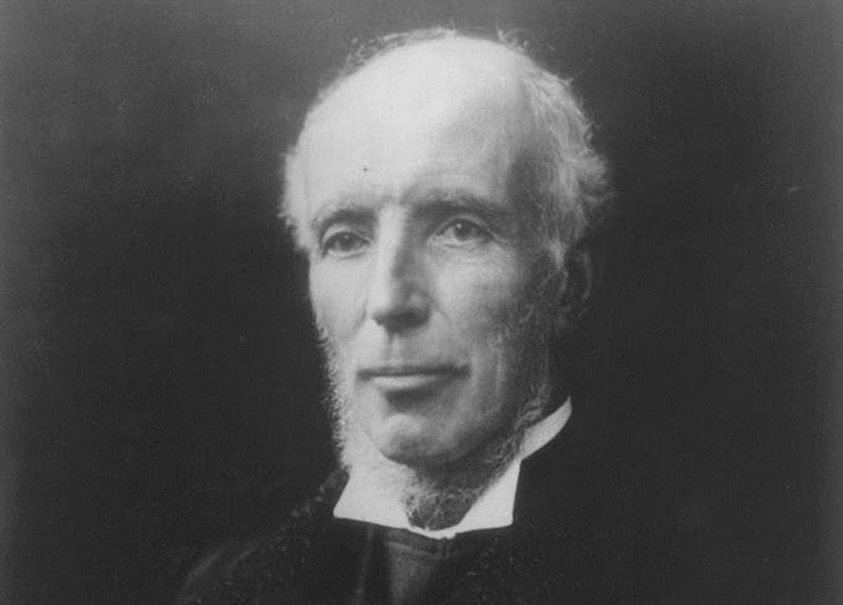 a black and white photo of a man in a suit