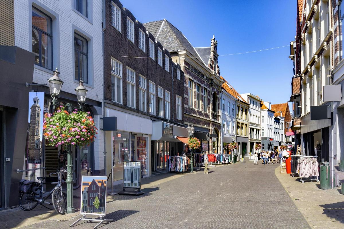 an empty street in a town with buildings