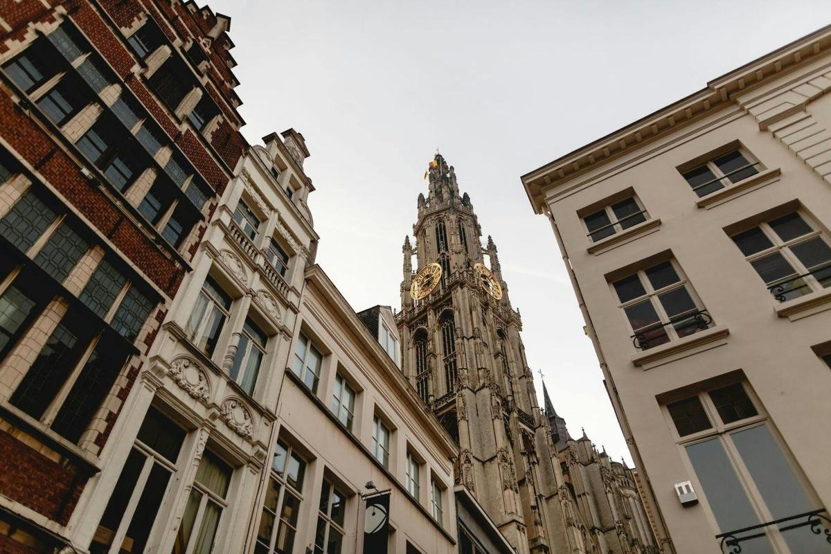 a tall building with a clock tower in the distance