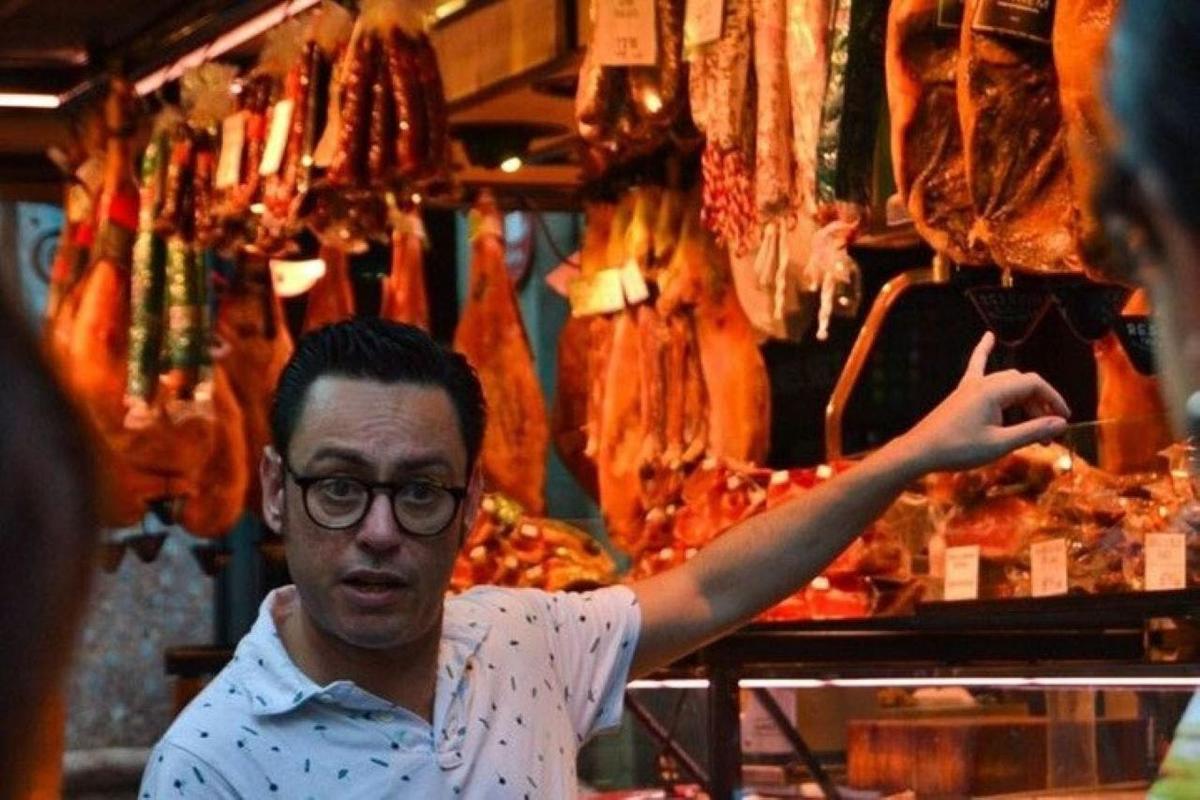 a man standing in front of a meat store