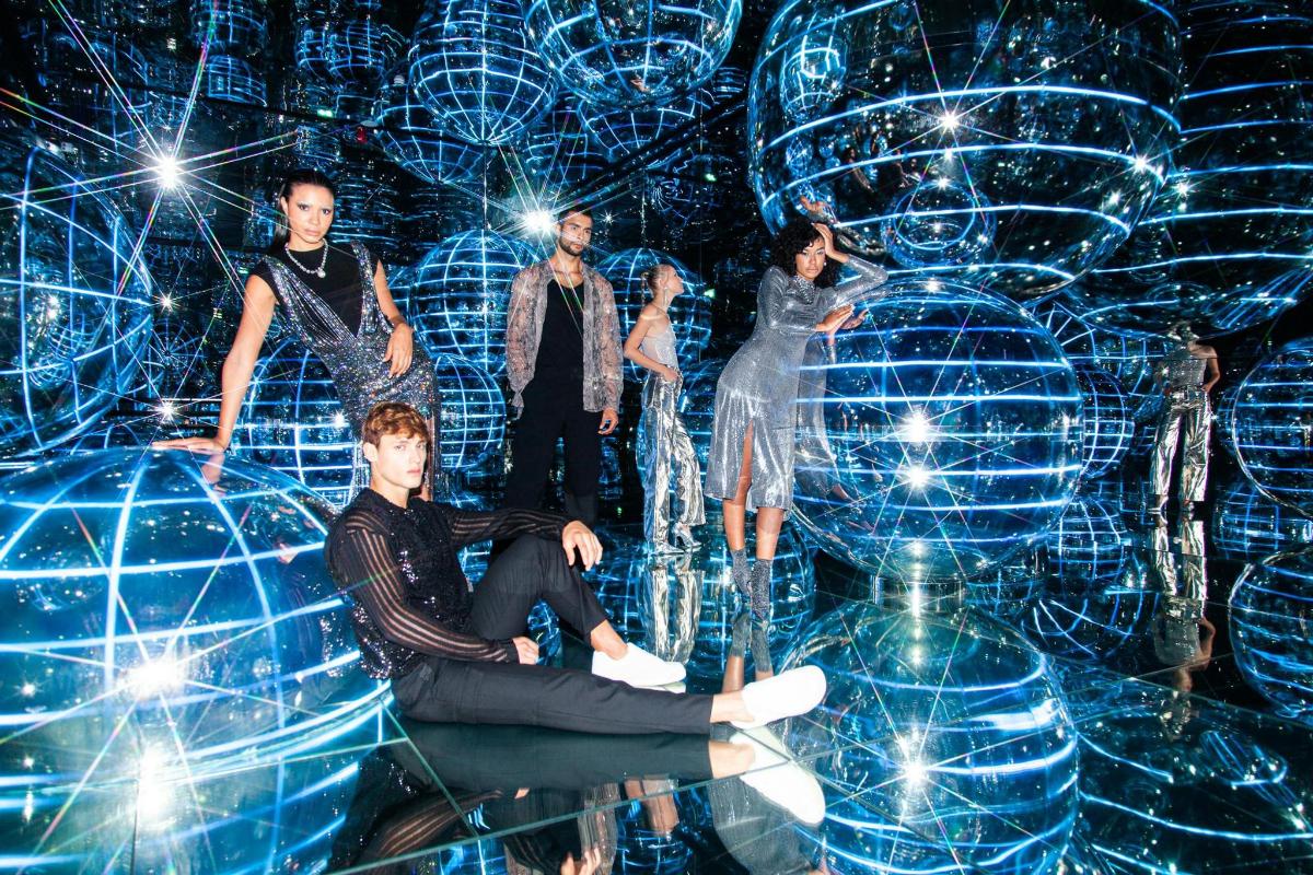 a group of people standing in front of a stage