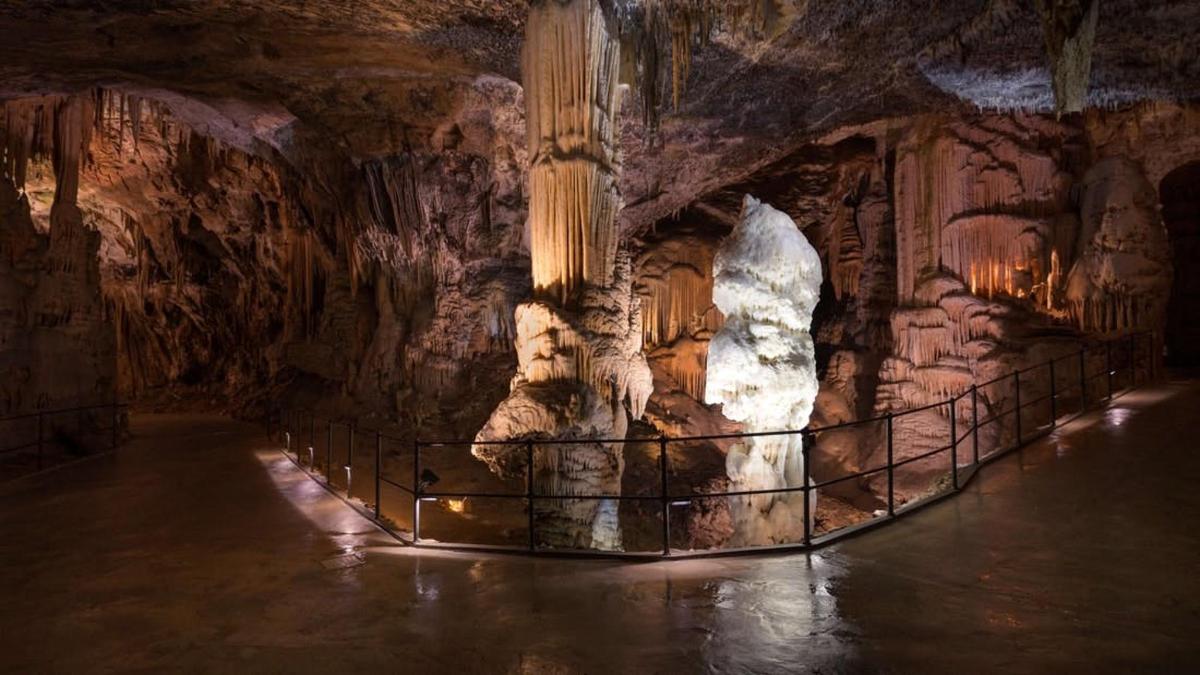 a cave with a pillar in a cave