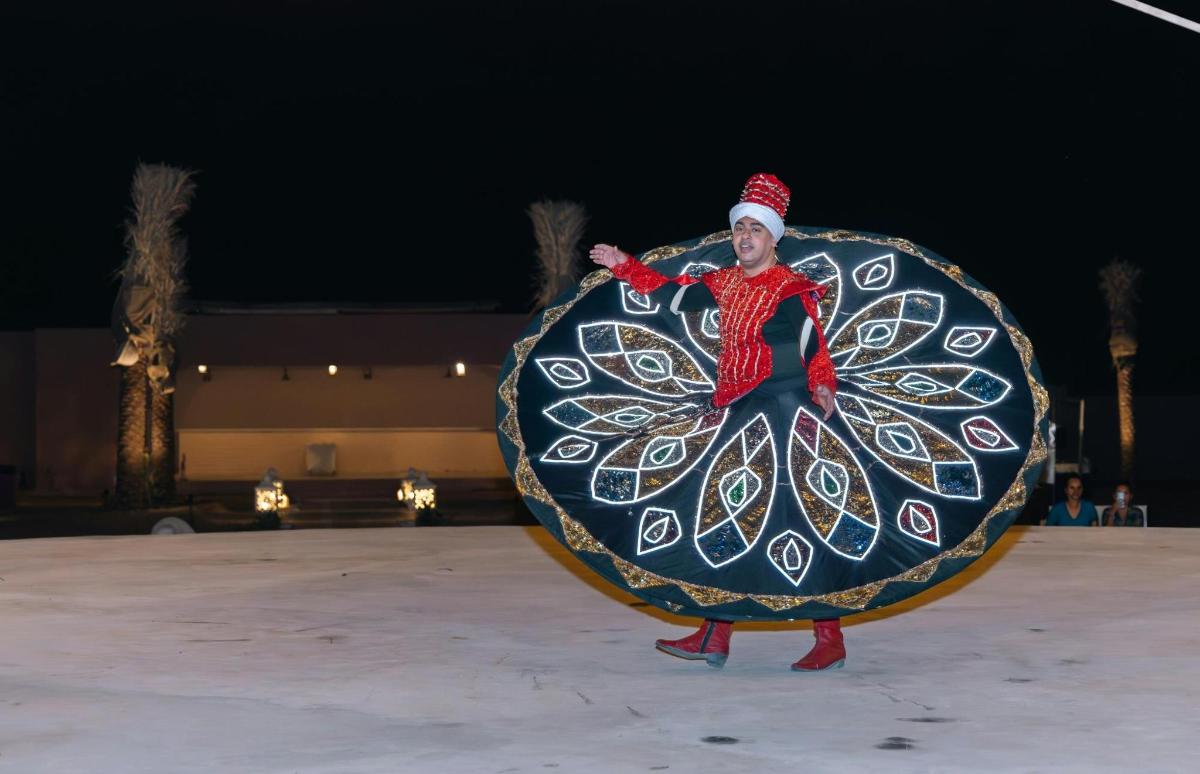a person in a santa claus costume holding a large