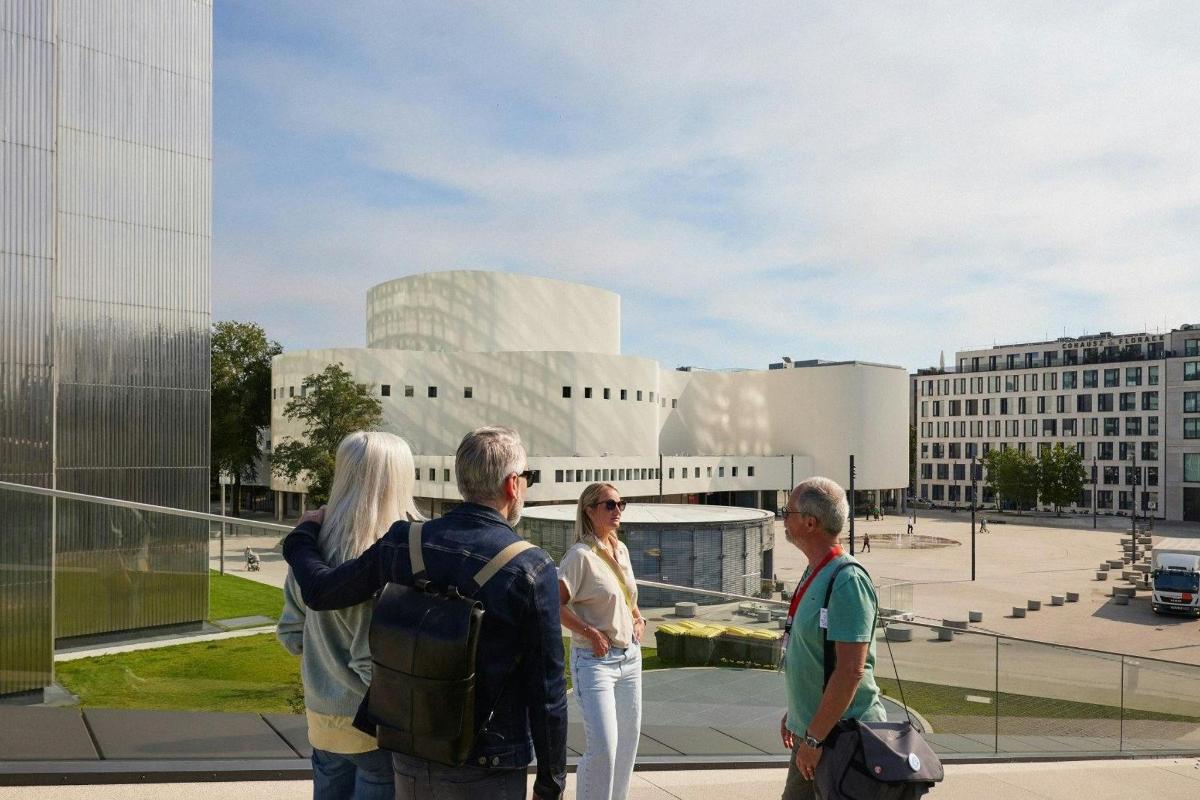 a group of people standing in front of a building
