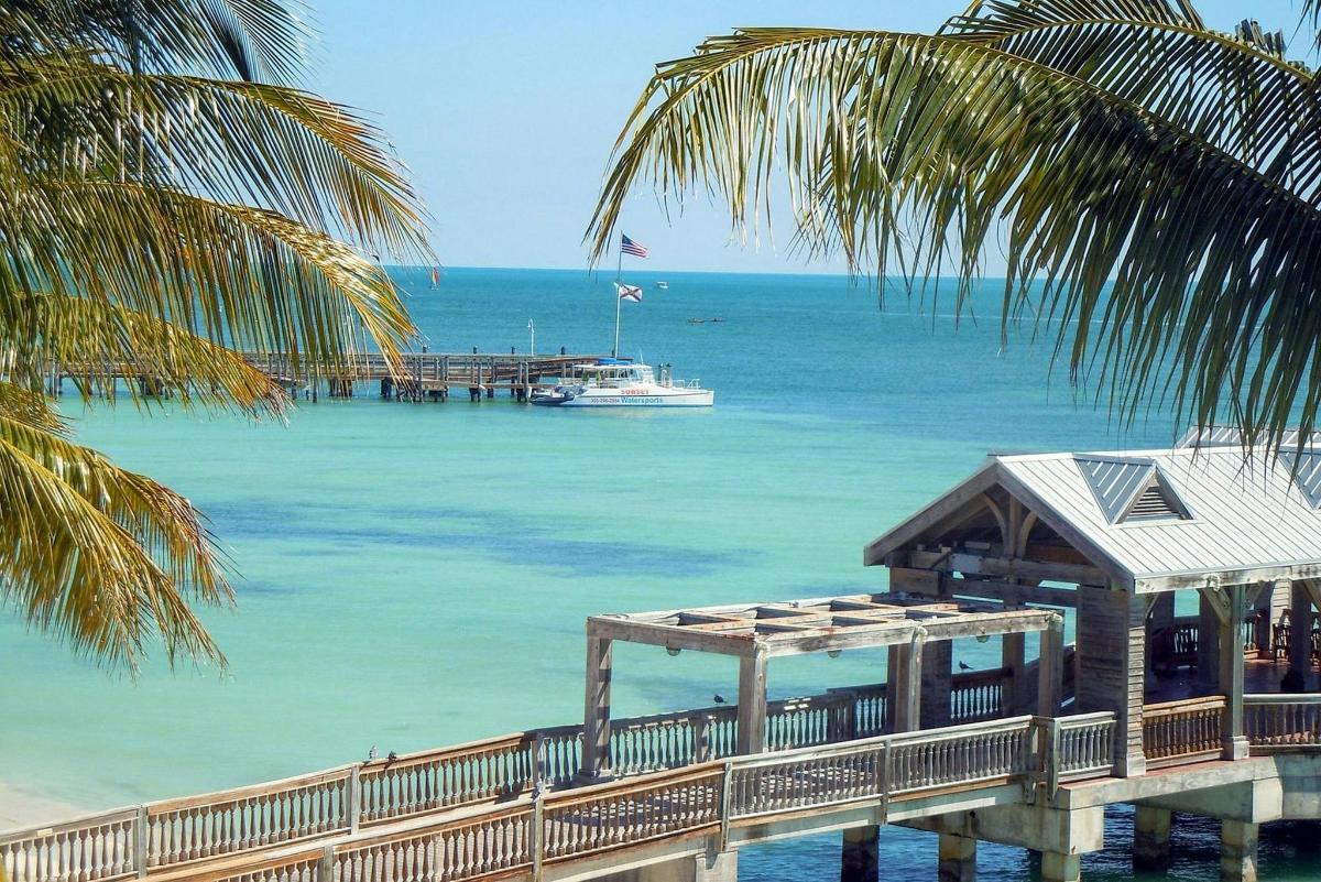 a boat in the water next to a dock