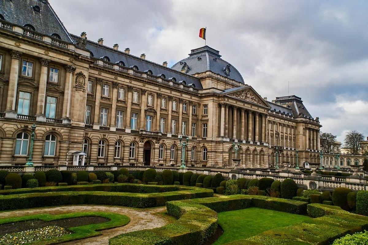 a large building with a garden in front of it