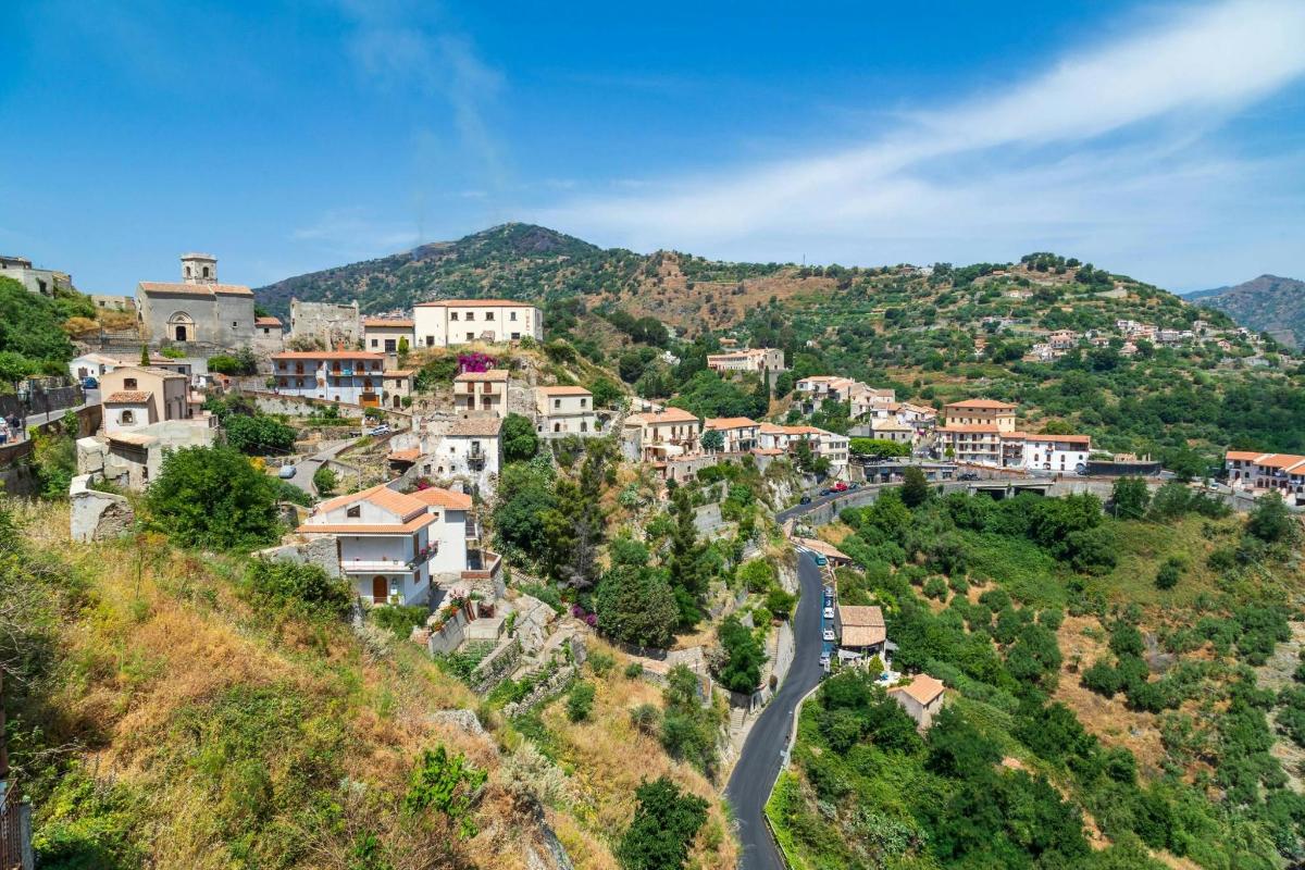 a village on a hill with a road